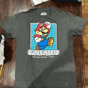 Youth tshirts in good used condition two have a few white dotted stains.